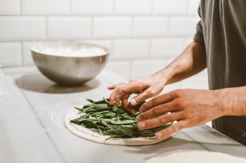 Giordanos deep dish pizza being prepared in our Chicago kitchen